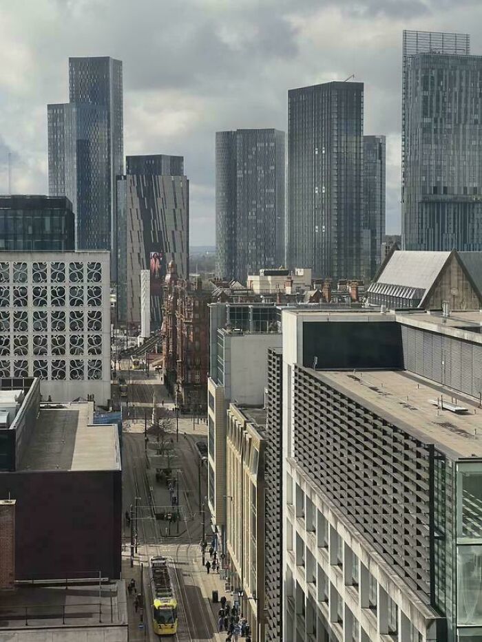 Modern city skyline with high-rise buildings and tram street in urban area