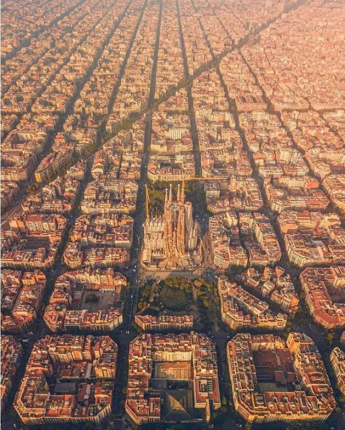 Aerial view of Barcelona city grid with Sagrada Familia cathedral in center