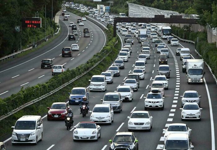 Dense traffic congestion on a multi-lane urban highway during rush hour