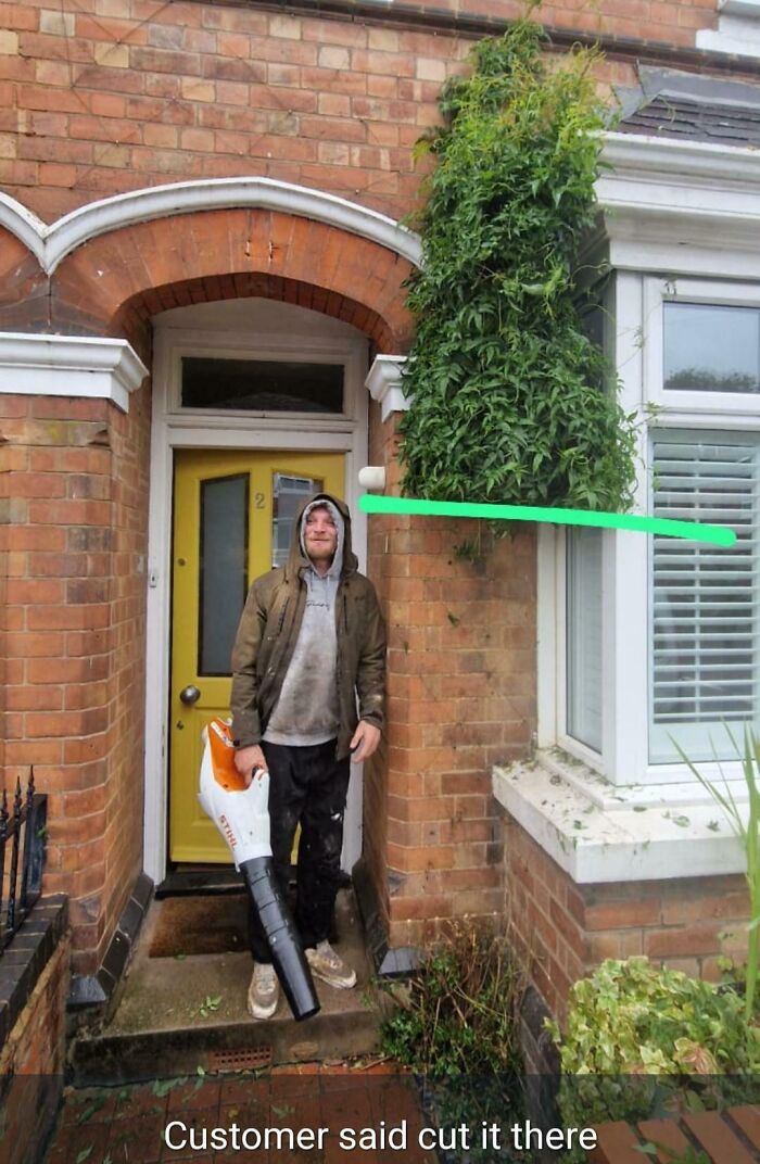 Funny garden trimming fail with overgrown bush and man holding blower