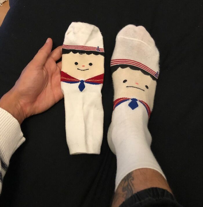 A pair of sailor socks with one sock worn upside down showing a funny clothes fail