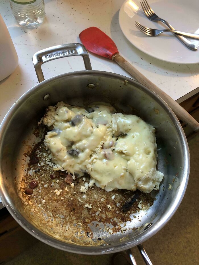 Funny cooking fail with burnt food stuck to stainless steel pan