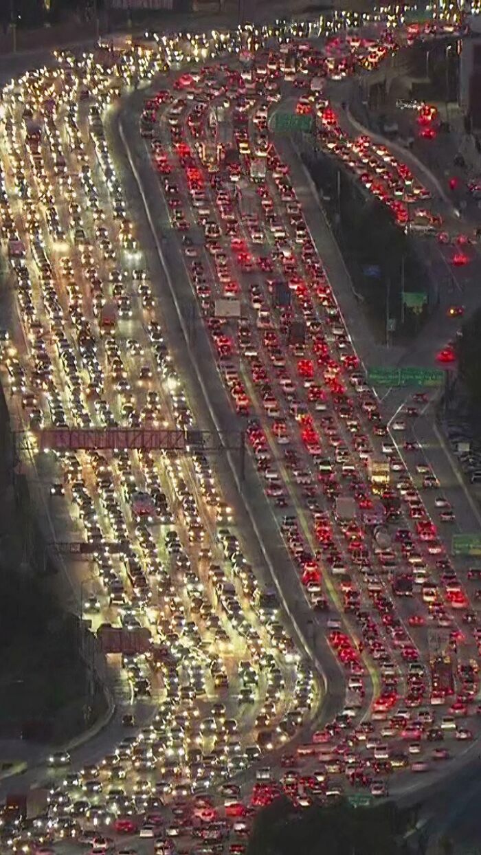 Heavy suburban traffic jam with many cars on multi-lane highway during evening commute