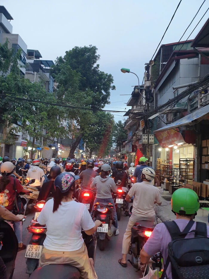 A crowded street with motorbikes, symbolizing the overwhelming and annoying situations students might face with toxic teachers.