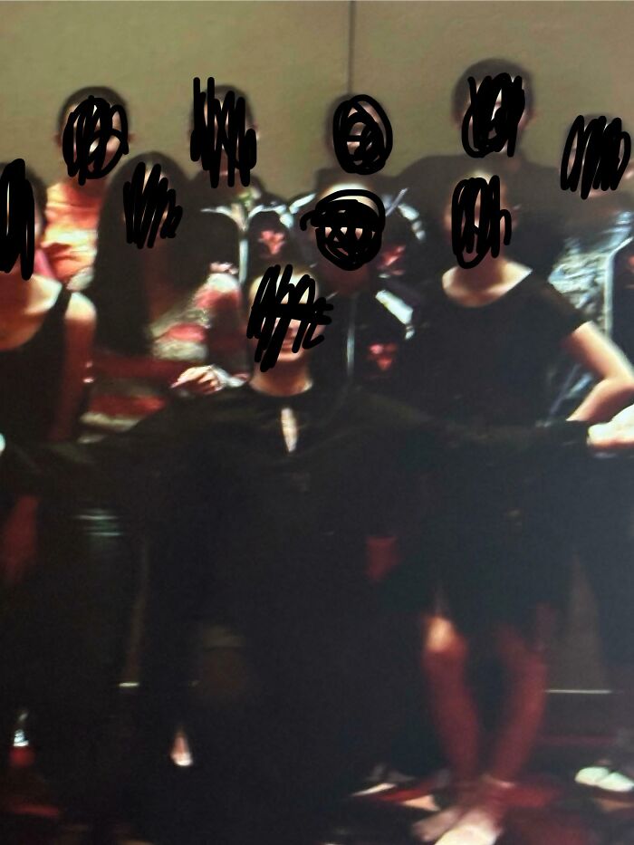 A blurry image of students with faces obscured, standing together. Some teachers are toxic and annoying.