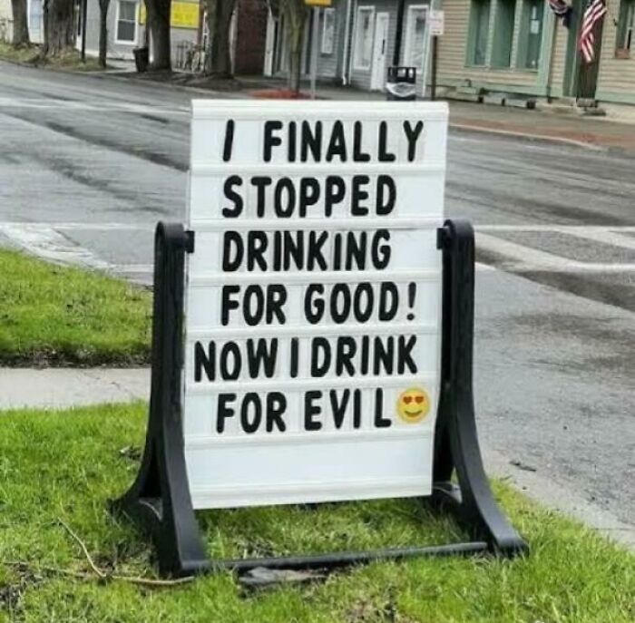 Funny sign about drinking for evil spotted outdoors
