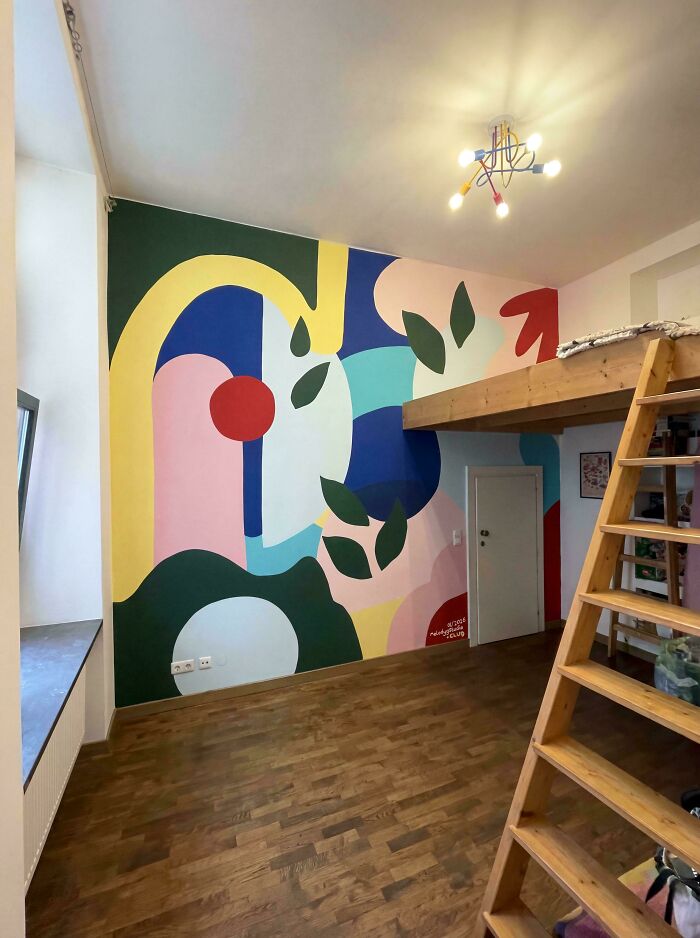 Modern home decor projects with a colorful abstract mural spanning a bedroom wall, and a wooden loft bed with a ladder.