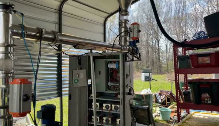 Dangerous things: An outdoor shot of industrial-looking machinery with pipes and electrical components, appearing exposed to elements.