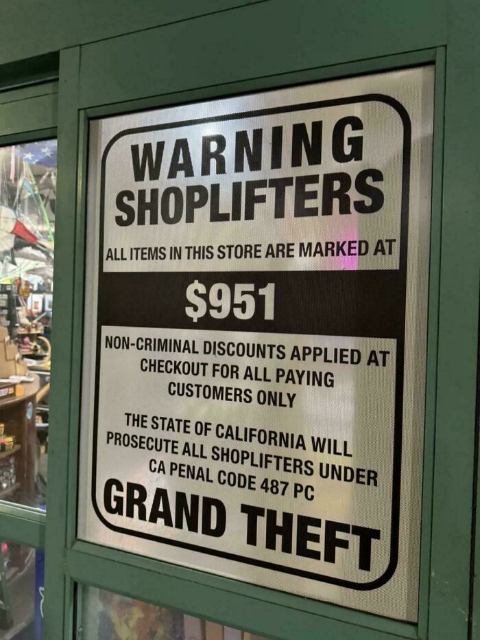 A clear warning sign about shoplifters and grand theft, presenting quick facts for a brain boost about store policies.