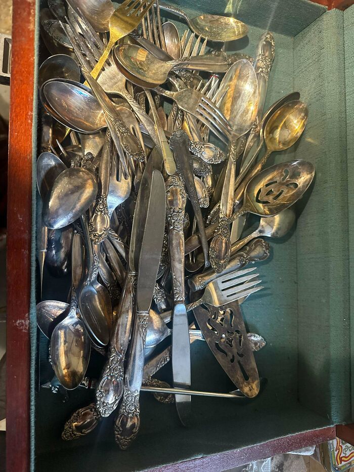 A drawer full of antique silver cutlery and serving utensils, remarkable antiques.
