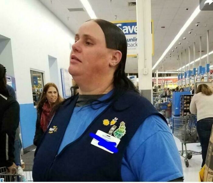 A Walmart employee with a bad hair day, showcasing a bizarre, sharply cut hairline that went viral.