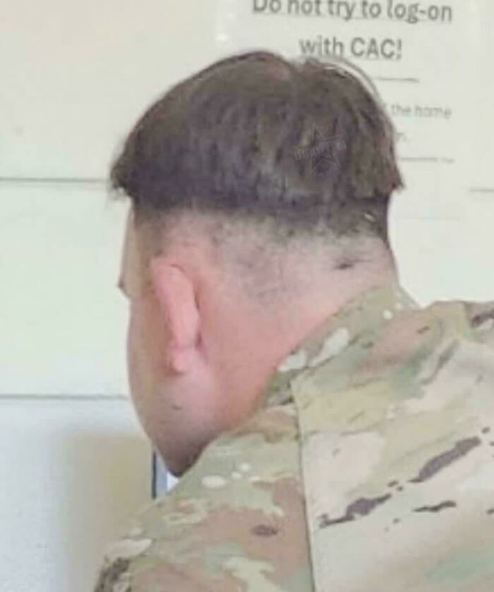 A soldier with a very bad hair day featuring an uneven, bowl-cut style that went viral.