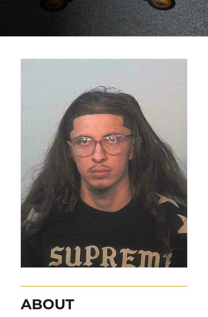 A man with extremely long hair and clear glasses, appearing to have a bad hair day, is shown in a mugshot style photo.