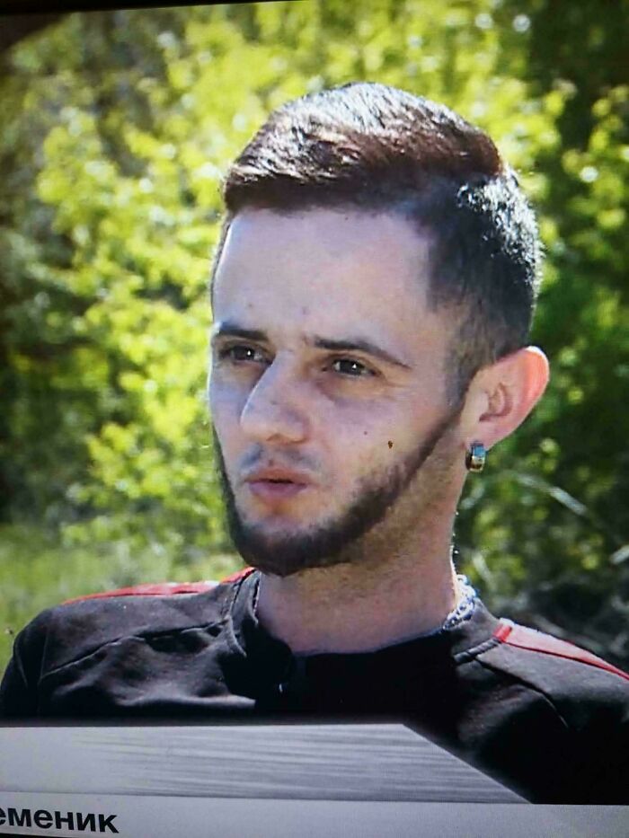 A man with a bad hair day and a patchy beard, looking straight ahead, will go viral on the internet.