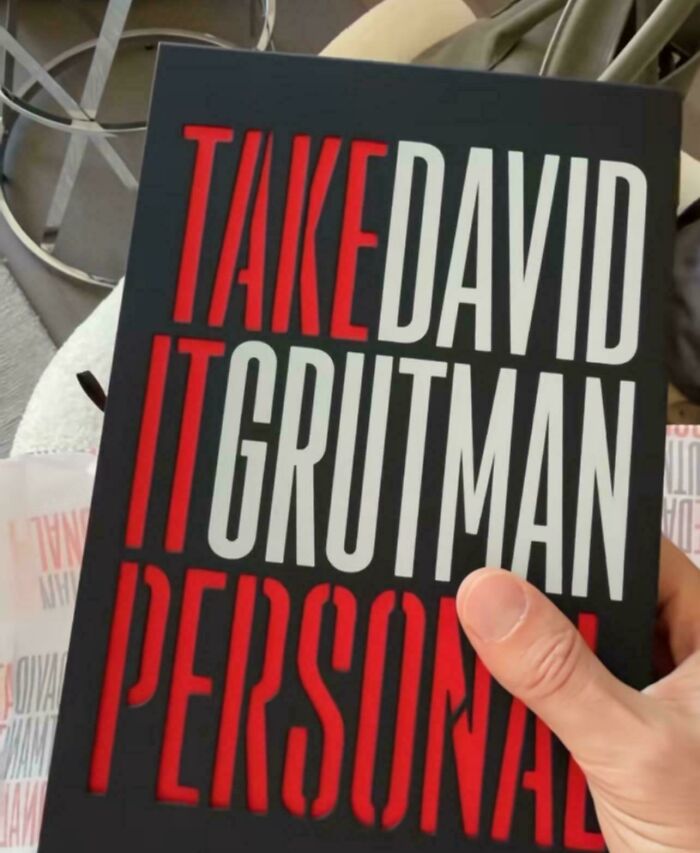 Hilariously confusing message from poor sign design: a book titled TAKE IT PERSONAL DAVID GRUTMAN.