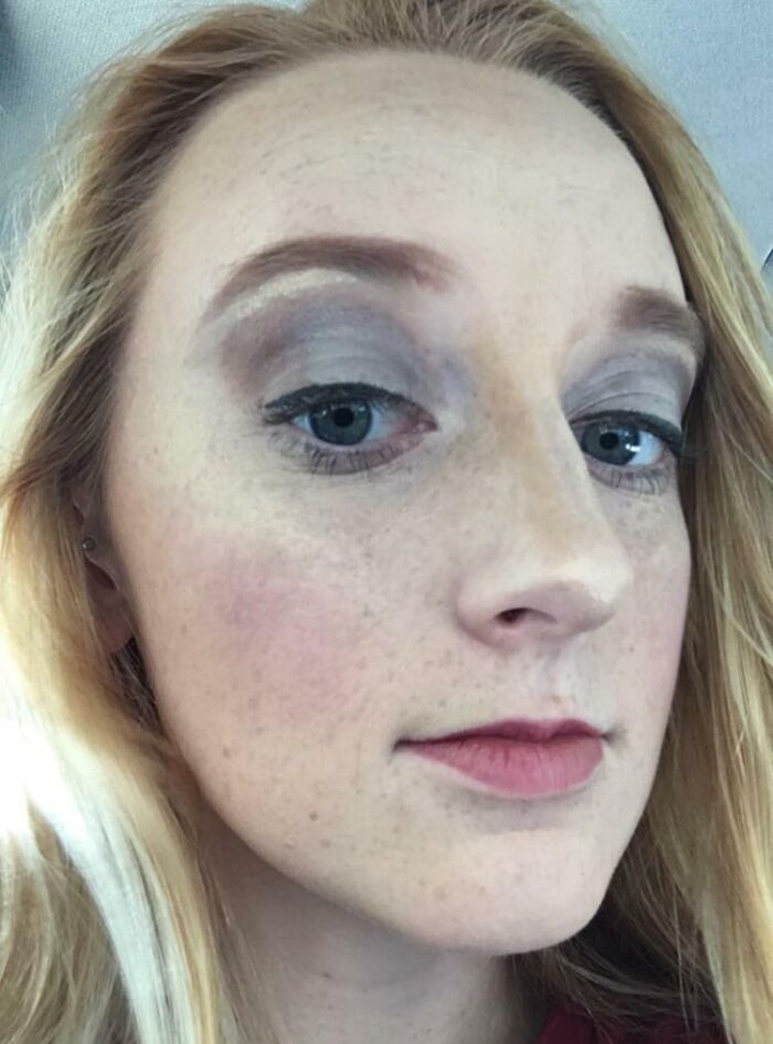 A blonde woman after a beauty salon visit, looking significantly worse due to poorly applied makeup.
