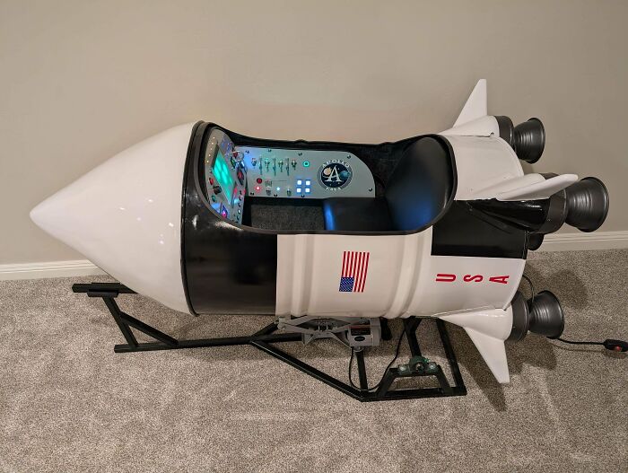 A custom-built rocket ship bed for a child with a US flag, illustrating the wholesome and fun side of being a dad.