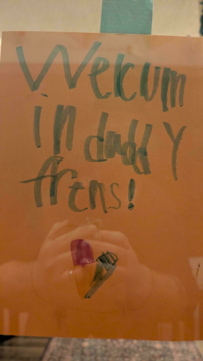 A handwritten welcome sign by a child showing the wholesome and fun side of being a dad.