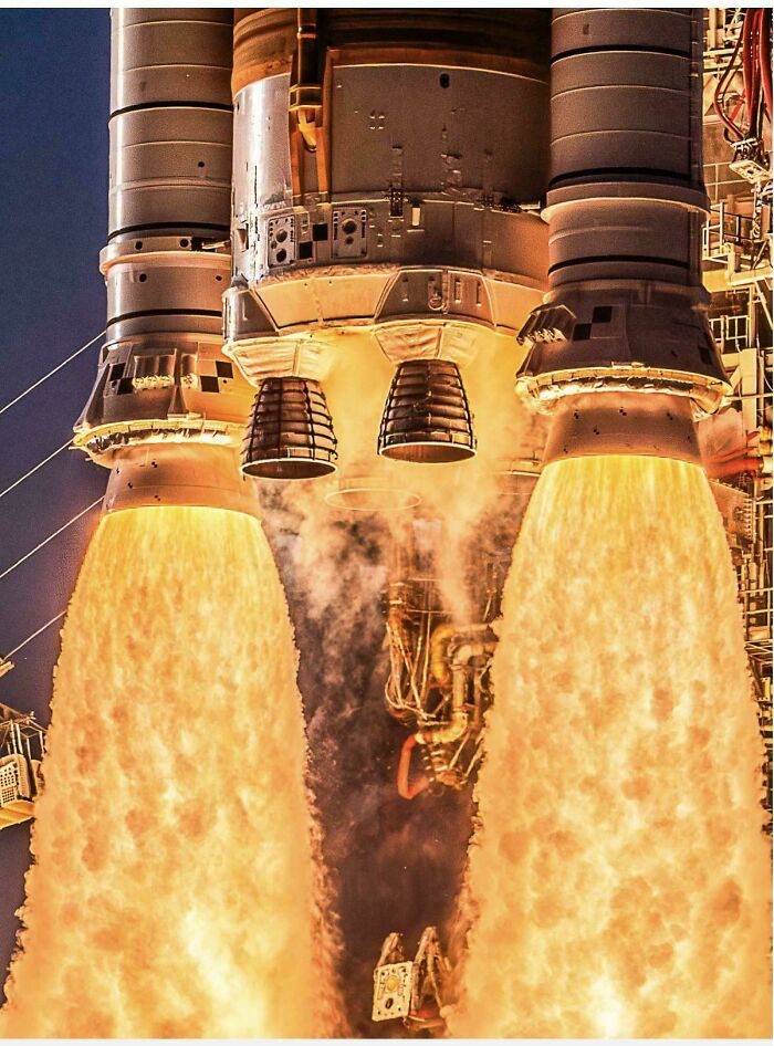 The powerful fiery engines of a rocket launching into space, captured in an interesting photo.