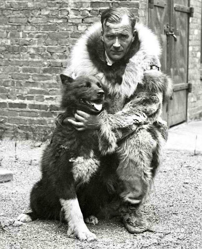 Historical photos: Explorer Knud Rasmussen with a dog, a powerful image of early 20th-century exploration.