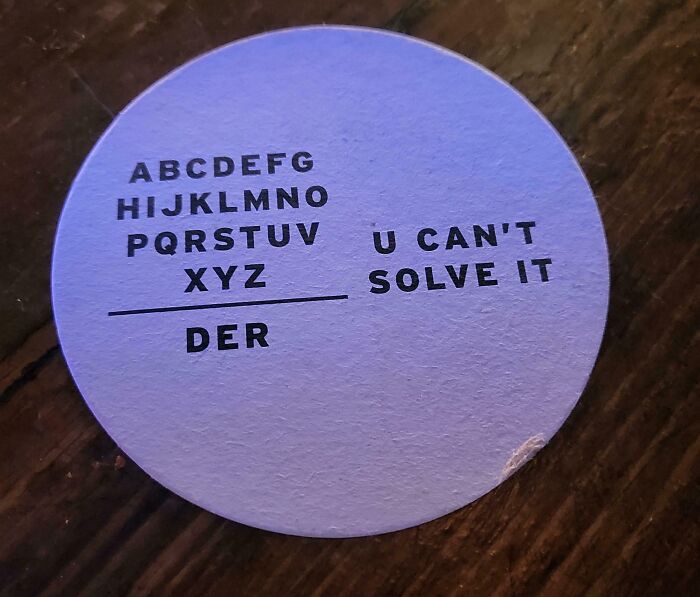 A wordplay brain puzzle on a coaster, asking to complete a phrase or solve a riddle.