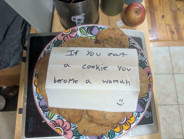 A plate of chocolate chip cookies with a humorous note, showing simple yet amazing and delicious treats by bakers.
