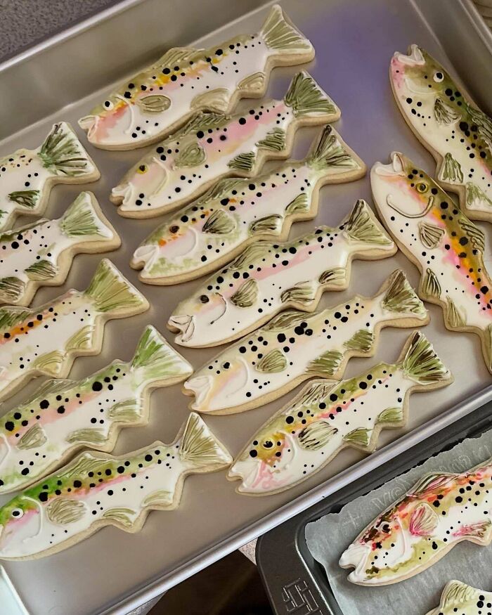 A tray filled with uniquely shaped fish cookies, showcasing a baker's creative and delicious treats.