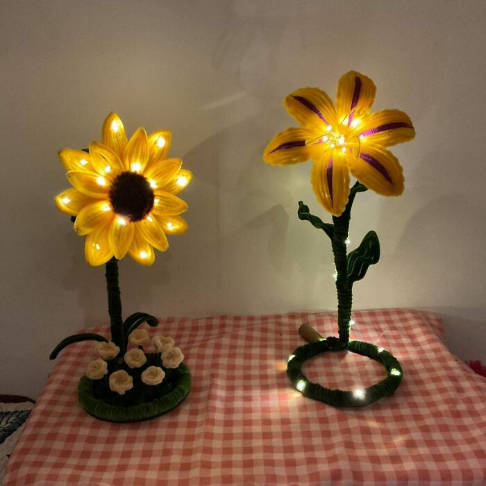 Two charming handmade projects, sunflower and lily shaped lamps, glowing with warm light, showcasing talent and magic.