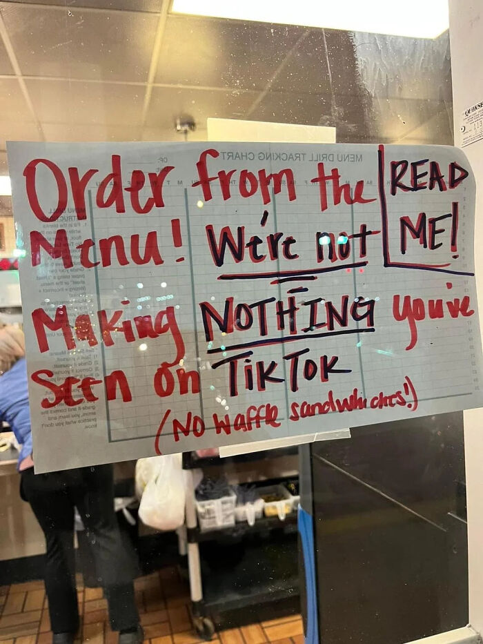 Restaurant sign instructing to order from menu, no TikTok trends allowed, funny no waffle sandwiches