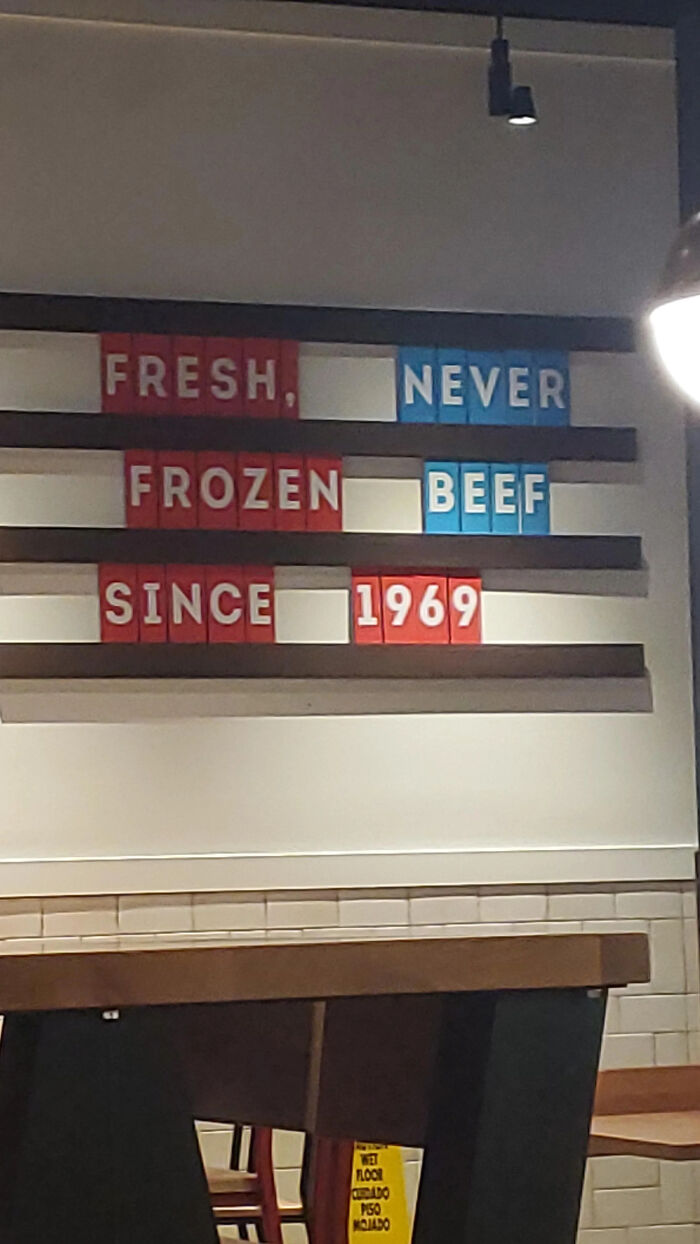 Sign humorously reading fresh never frozen beef since 1969