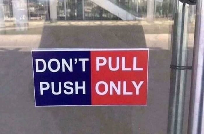 Funny door sign confusing push and pull instructions