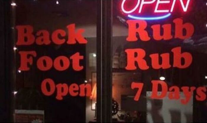 Sign advertising back and foot rub services open seven days