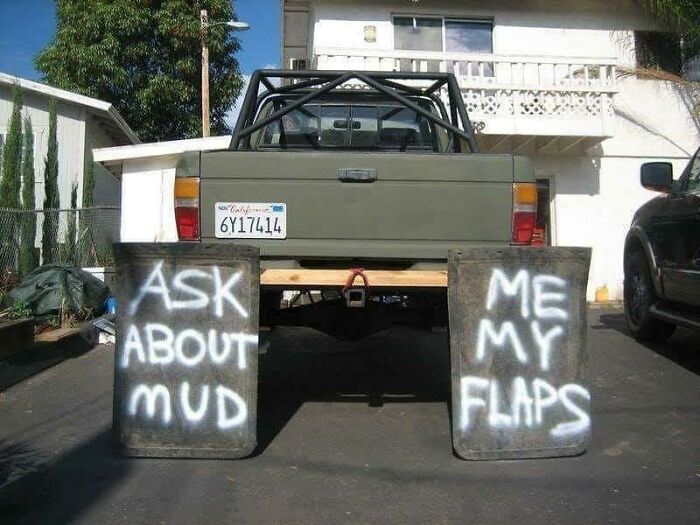 Truck with mud flaps that say ask about my mud flaps in bold