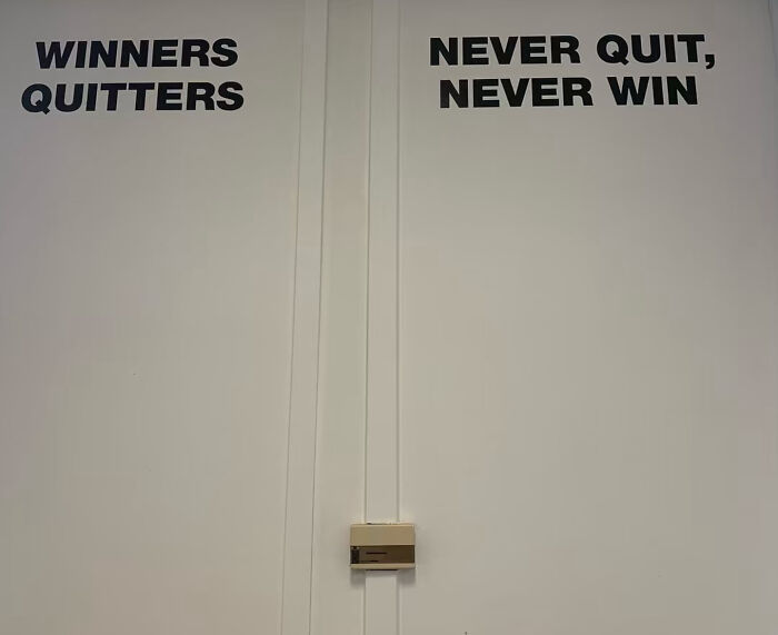 Wall sign with motivational quote winners quitters never quit never win
