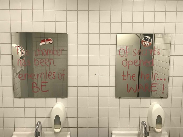 Graffiti on bathroom mirrors referencing chamber of secrets