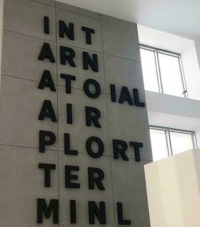 Incorrectly arranged letters on a sign for international airport terminal