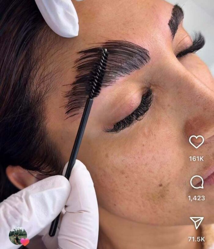 A close-up of a person's eyebrow being brushed up, illustrating a beauty salon treatment gone wrong.