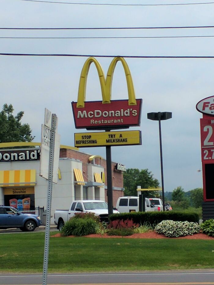 McDonald's sign with incorrect message stop refreshing try a milkshake outside restaurant