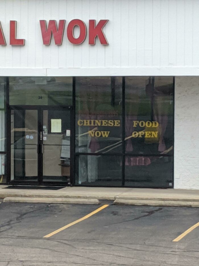 Chinese food now open sign on restaurant with missing letters