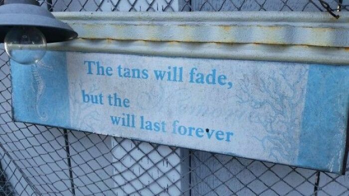Sign about tans fading with irony highlighting lasting effect phrase