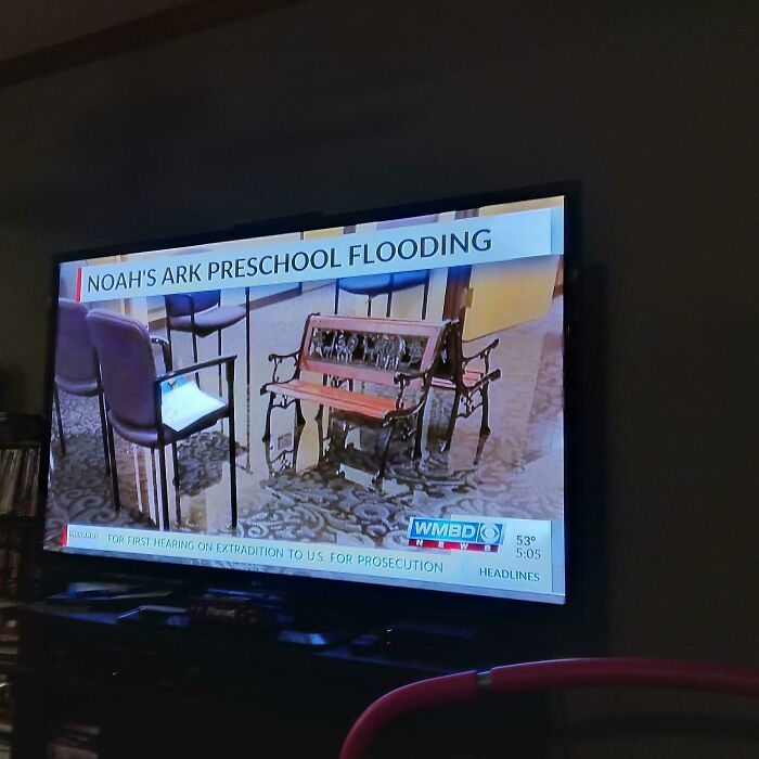 News report about Noah's Ark Preschool flooding showing empty chairs and bench irony