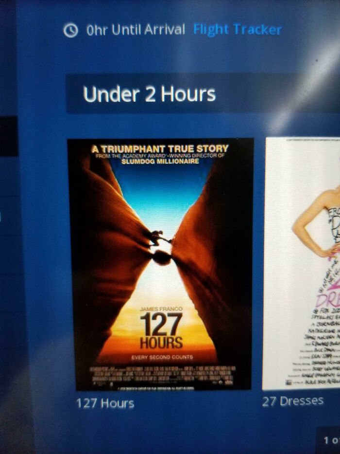 Flight screen showing 127 Hours movie under 2 hours flight duration irony