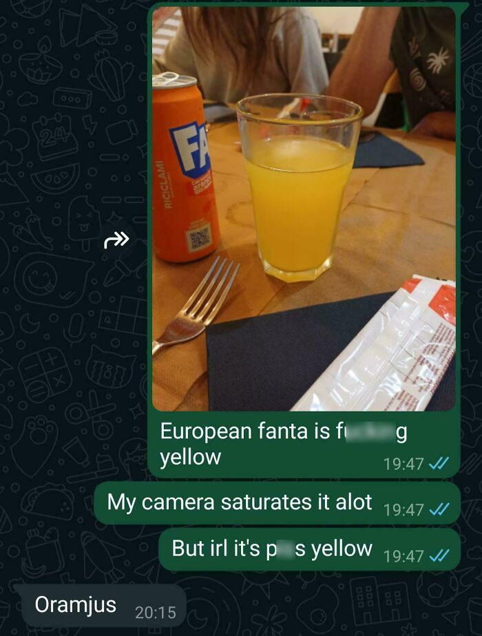 Glass and can of European Fanta with conversation about its yellow color on phone