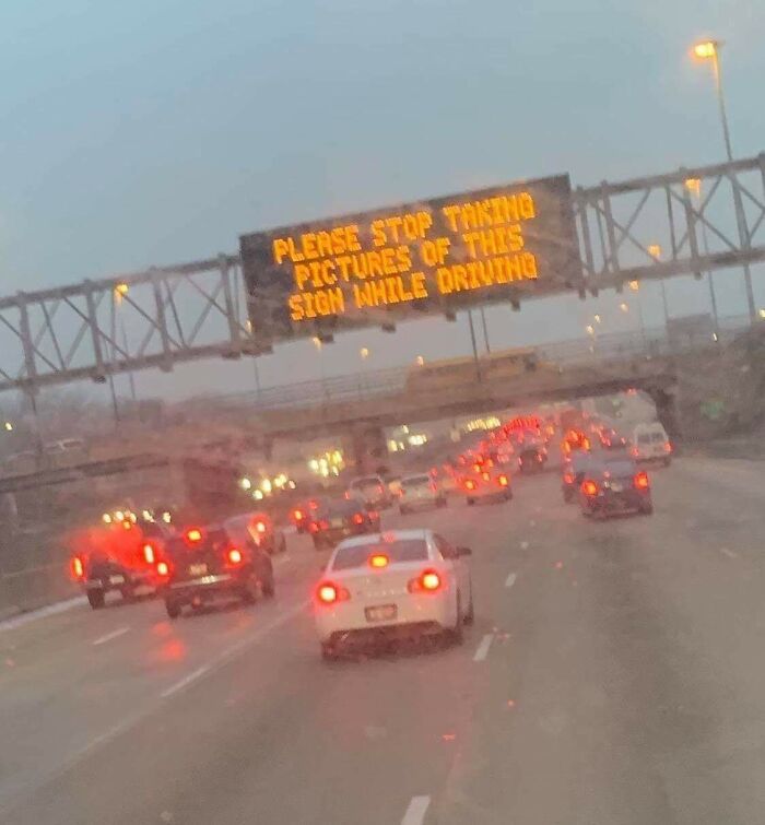 Electronic road sign ironically asks drivers to stop taking pictures while driving
