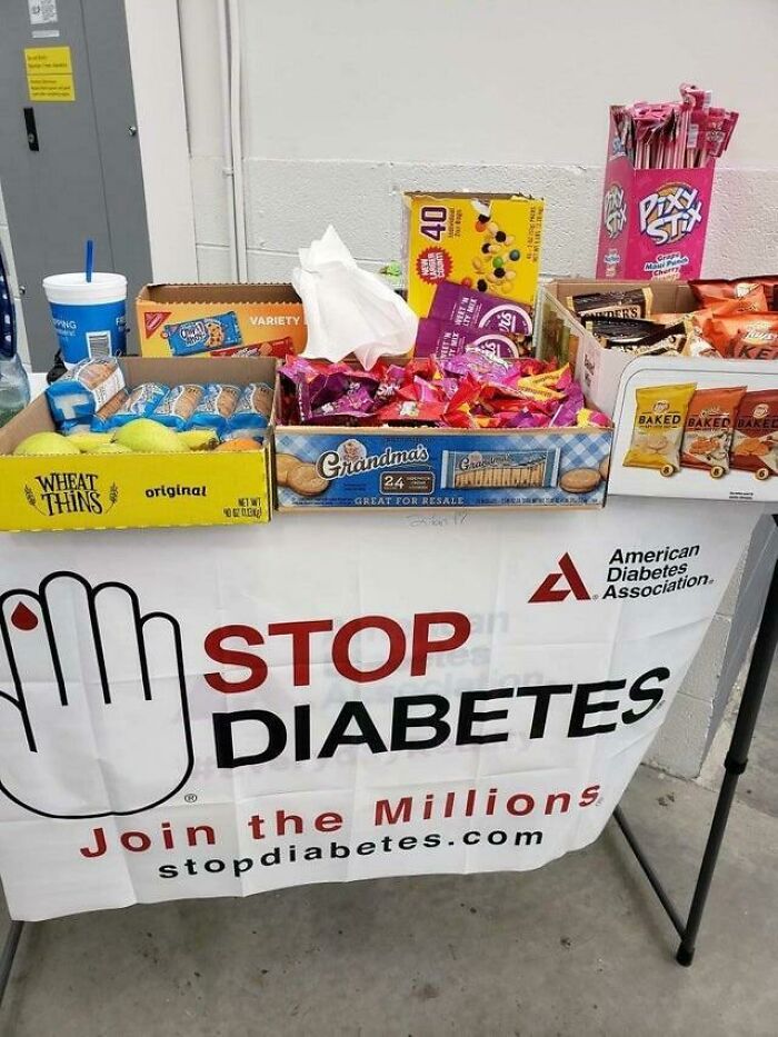 Stop diabetes banner with table full of sugary snacks ironically