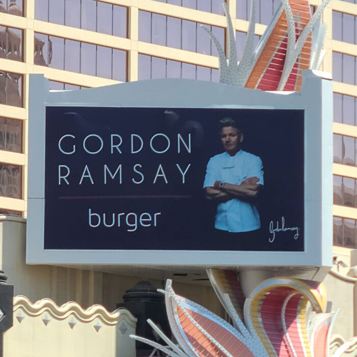 Gordon Ramsay burger restaurant sign with chef portrait