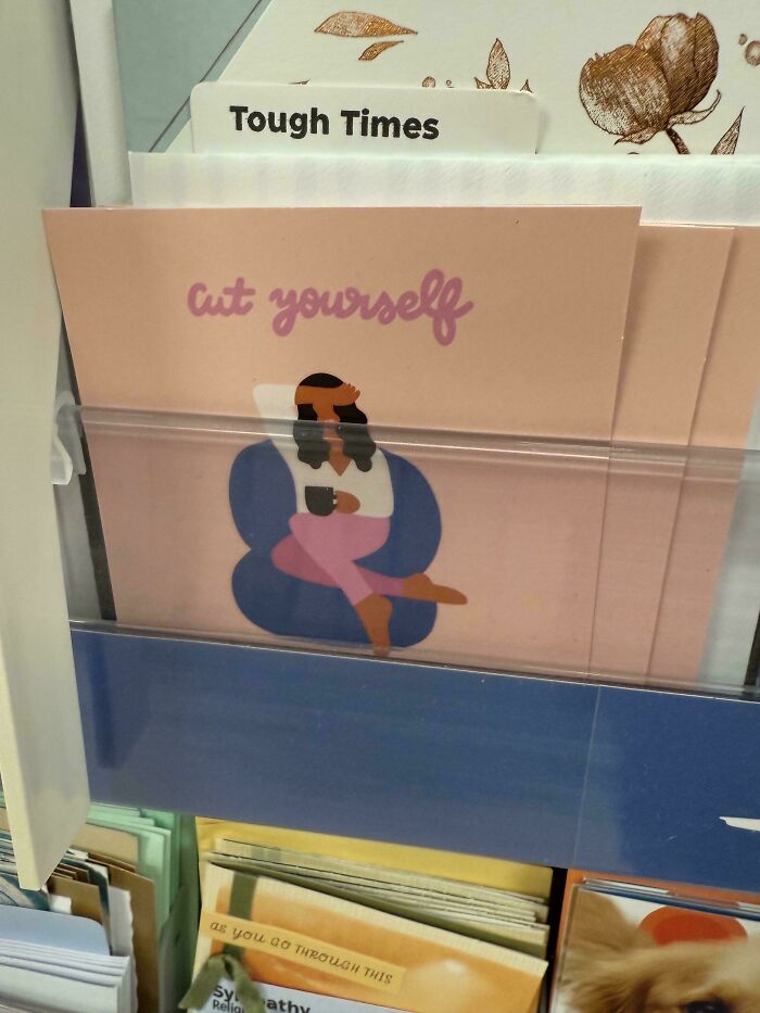 Card design fail showing greeting card with confusing 'cut yourself' message