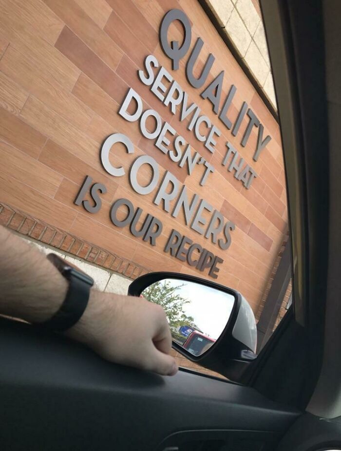 Sign claims quality service doesn't cut corners in ironic photo from car