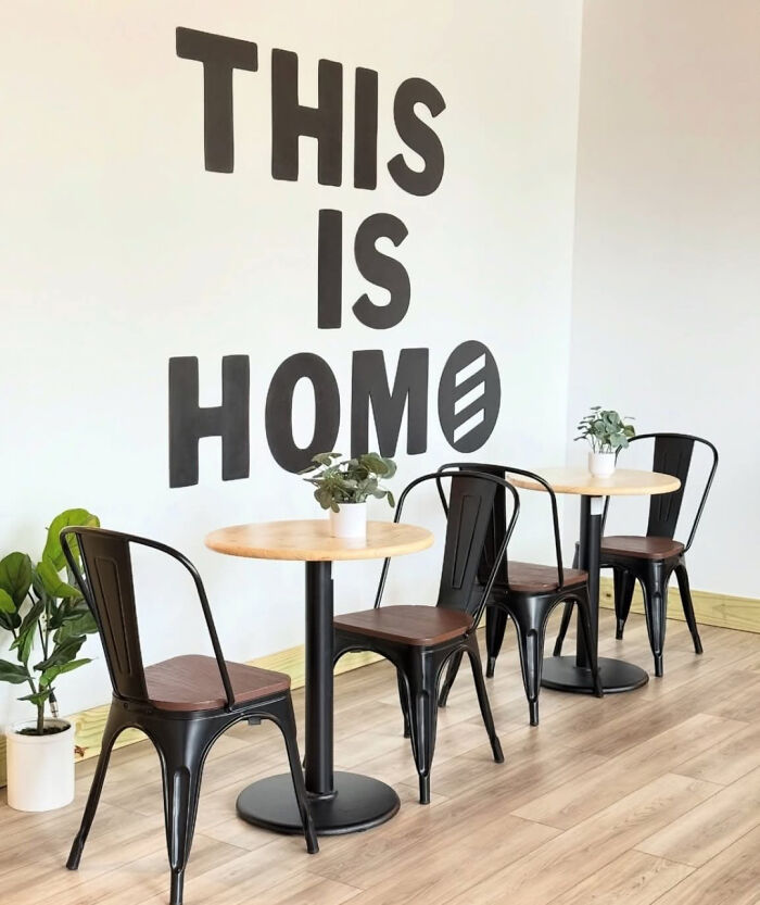 Wall art in cafe with misspelled phrase showing an unfortunate design fail