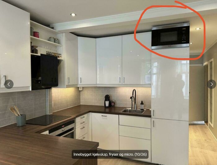 Kitchen design fail with microwave placed too high over refrigerator